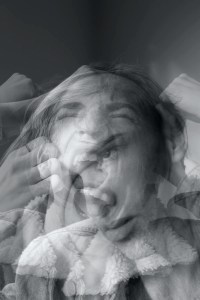 Several-exposure image of a person yelling at themselves